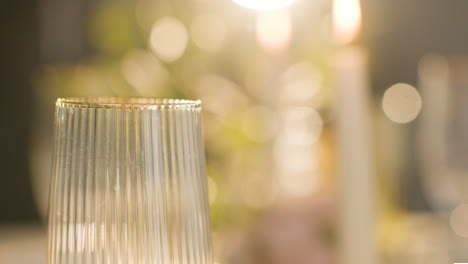 Close-Up-Of-Gold-Rimmed-Glass-On-Table-Set-For-Meal-At-Wedding-Reception-1
